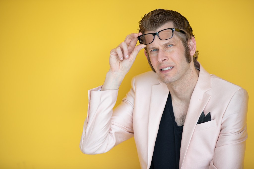 Fig. 1. Jeremy Swenson, Ink Suit Yellow Background, 2025.